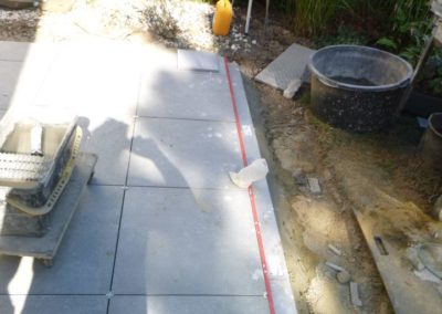 Réfection d'une terrasse avec des pavés céramiques 60/60 cm.

Réalisation d'un empierrement le l...