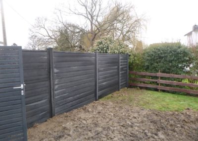 Rénovation d'un petit jardin à Ans.

Remplacement des vielles palissades de bois par une palissade...