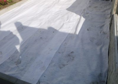 Aménagement complet d'un petit jardin à Herstal, création d'un espace parking, placement de palis...